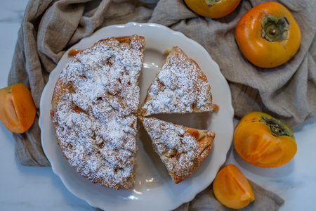 Pieces of cake decorated with persimmons