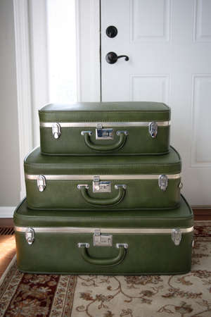 Vintage luggage waiting by the door.の写真素材