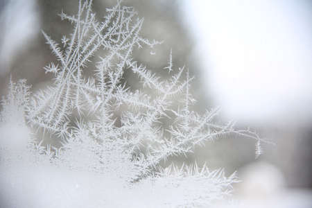 Sketchy lines of frost on a window.