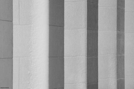 straight columns in a row in the snowの写真素材