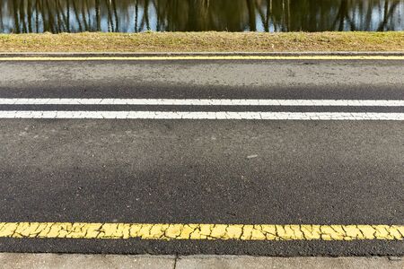 yellow and white asphalt bike path Minskの写真素材