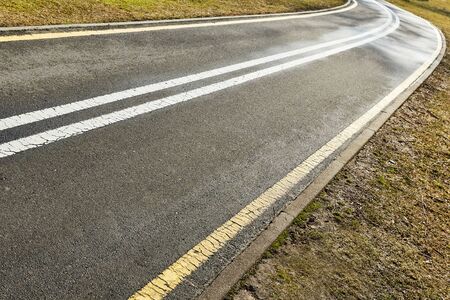yellow and white asphalt bike path Minskの写真素材