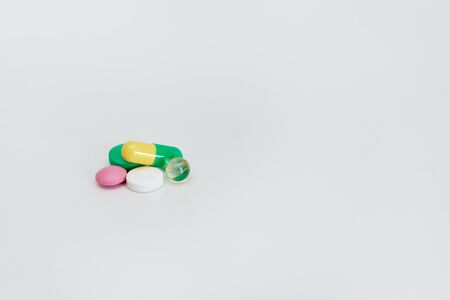 pills and medicines lie on a white background four unitsの写真素材