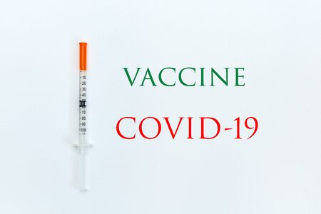 syringe on a white background with the inscription green and redの写真素材