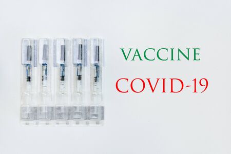 syringe on a white background with the inscription green and redの写真素材