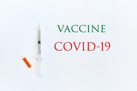 syringe on a white background with the inscription green and redの写真素材