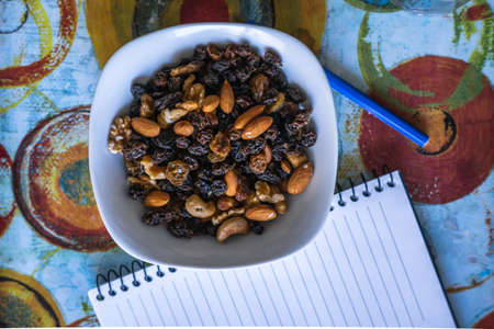 plate of nuts and notebook, indoorsのeditorial素材