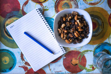 plate of nuts and notebook, indoorsのeditorial素材