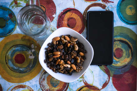 plate of nuts and a book, indoorsのeditorial素材