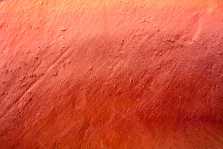 Warm color gradient paint on wall. Close-up of a graffiti texture. Street art background.