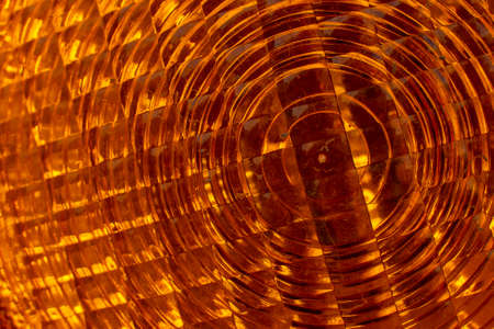 Orange warning light texture. Close-up.