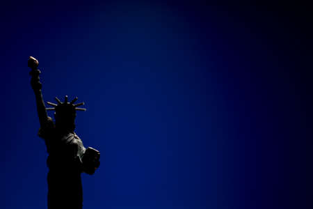 Statue of Liberty silhouette. USA Independence Day. Black lives matter. Dark blue background with copy space.の写真素材
