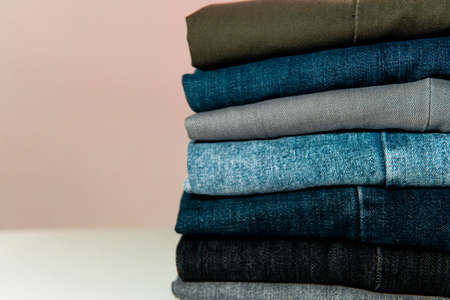 Stack of pants, different colors, texture, close up view, fashion and lifestyleの写真素材