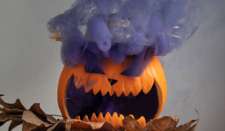Halloween pumpkin with smokeの写真素材