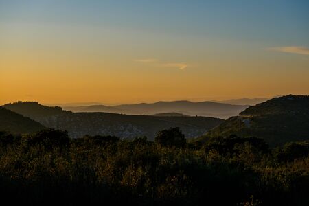 Colorful mountain landscape at sunset. Magic sunset with amazing colors in the sky.の写真素材