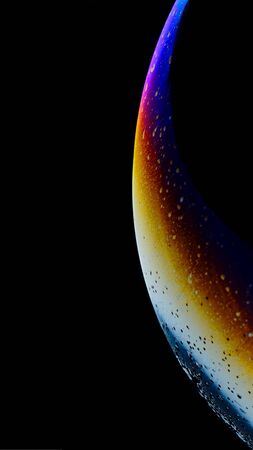 Macro photography Abstract macro photography. Close-up of colorful soap bubbles on a black background .. Close-up of colorful soap bubbles on a black background.の写真素材