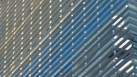 Modern building with glass windows reflected skyの写真素材