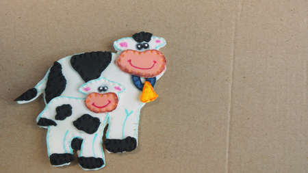 Cow and calf made of foamy on cardboard - School children workの写真素材