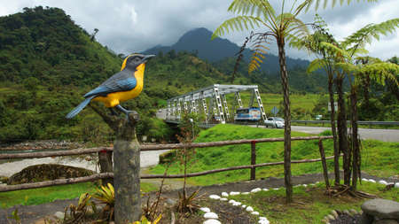 Cosanga, Napo / Ecuador - January 16 2016: Sculpture bird with yellow breast at the entrance of the town of Cosangaのeditorial素材