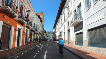 Quito, Pichincha / Ecuador - January 22 2016: Man walking on a bicycle in the Historic Center of Quito.のeditorial素材