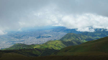 Rain clouds over the city of Quito seen from the moor of the Pichincha volcano Rucuの写真素材