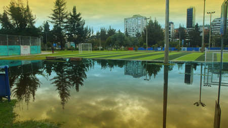 Quito, Pichincha / Ecuador - April 27 2016: Large puddle of water in the Carolina Park at sunset after the rainのeditorial素材