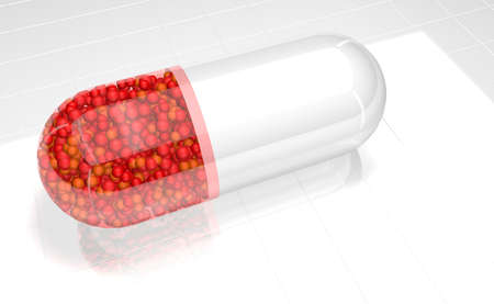 Close up on white plastic capsule with transparent red half full of red spheres on a white reflective surface. 3D Illustrationの写真素材