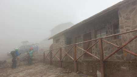 Cayambe, Pichincha / Ecuador - February 24 2020: People dressed in climbing gear standing next to the Ruales Oleas Berge refuge located next to the Cayambe volcanoのeditorial素材