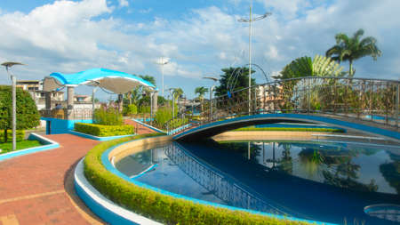 Nueva Loja, Sucumbios / Ecuador - December 8 2019: View of the Central Park of Nueva Loja during the morning with cloudy skyのeditorial素材