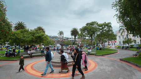 Otavalo, Imbabura / Ecuador - October 14 2023: People walking in front of the fountain in the central park of Otavalo during a cloudy dayのeditorial素材