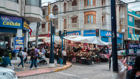 Otavalo, Imbabura / Ecuador - October 14 2023: People walking through the city center in front of the street marketのeditorial素材