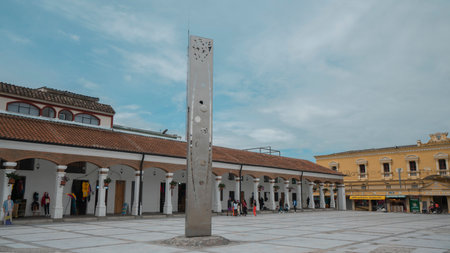 Otavalo, Imbabura / Ecuador - October 14 2023: People walking in the Plaza Civica in the center of the city of Otavalo on a cloudy dayのeditorial素材