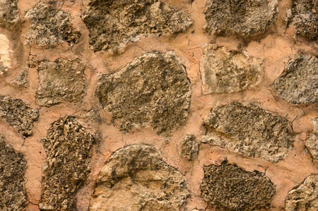 The photo shows a stone wall, delimitation of the natural stone of Kalichi is clearly visible....