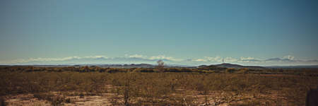 wind energy. Yellow dry field in the background mountains with wind turbines. windpower. Wind effectiveness in carribbean island. Air effectiveness in tropical country. breeze electricity,の写真素材