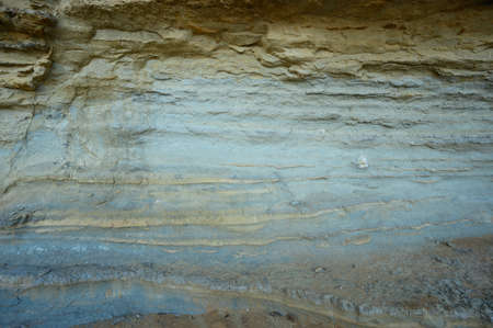 Rubble beach view. ocean front structure on atlantic beach. Multicolor slag backdrop on ocean beach...