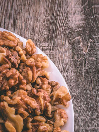 Walnut background horizontal close-up hd. A high quality photo of the pecan, captured with extra sharpness. The stunning picture quality of the pecan can be used to decorate any space.の写真素材