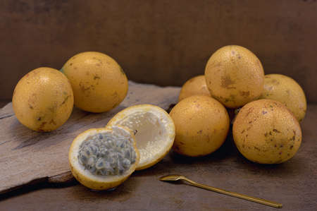 The photo shows an exotic fruit native to the tropics. The tropical fruit is called granadilla or...