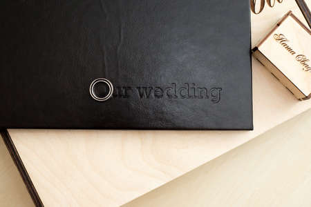 wooden box with rings under photosの写真素材