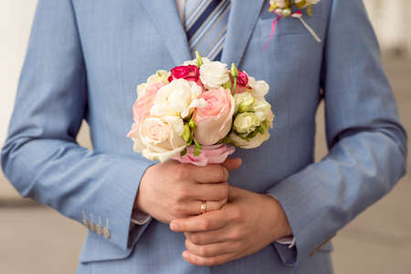Wedding Bridal bouquet in the handsの写真素材