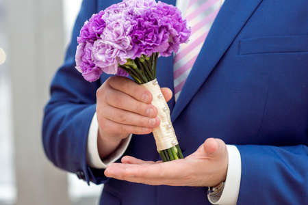Wedding Bridal bouquet in the handsの写真素材