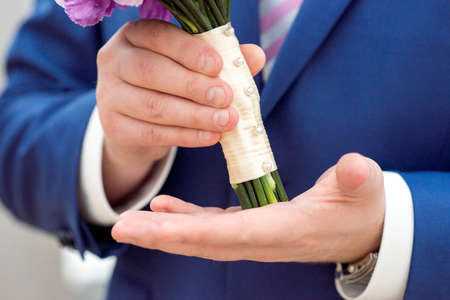 Wedding Bridal bouquet in the handsの写真素材