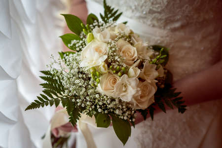 Wedding Bridal bouquet in the handsの写真素材