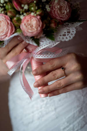 Wedding Bridal bouquet in the handsの写真素材