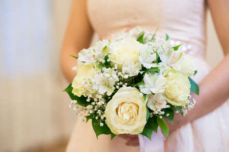 Wedding Bridal bouquet in the handsの写真素材