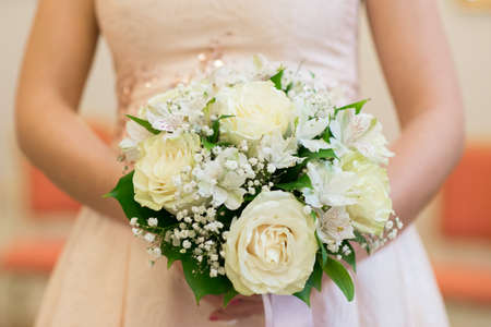Wedding Bridal bouquet in the handsの写真素材