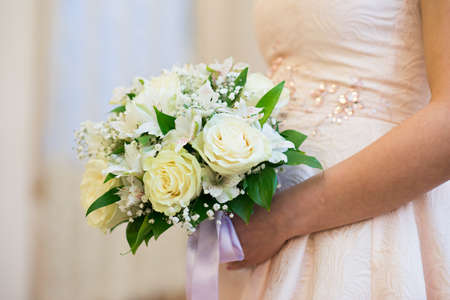 Wedding Bridal bouquet in the handsの写真素材