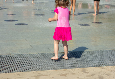 People bathe in the fountain.Summer heat in the city.の写真素材
