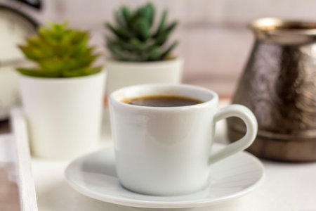 A Cup of morning coffee and a Turk on the table.の写真素材