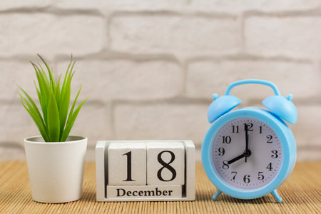 A bunch of three keys to the apartment is on a gray background with a copy of the space.の写真素材