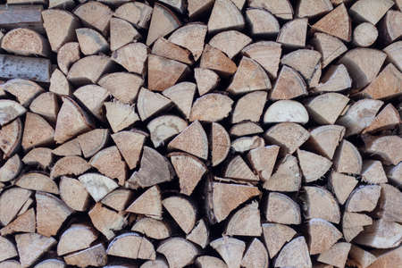 Woodpile Of Sawn Spruce Logs. Firewood For Heating The House In Winter.